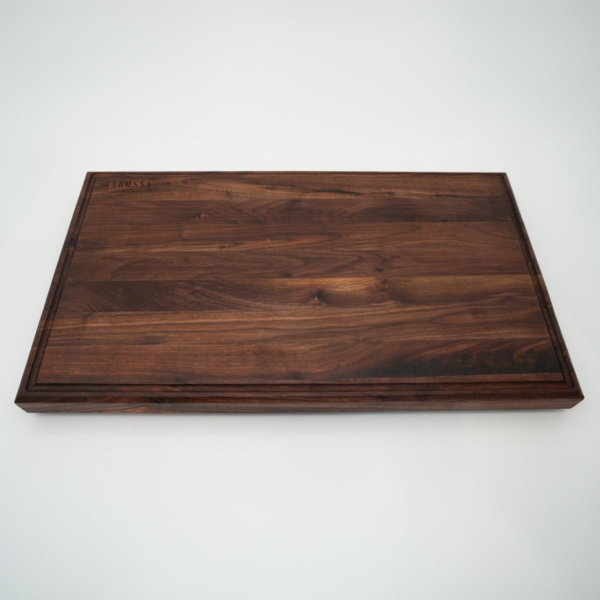 BABOSSA | Nussbaum Schneidebrett XL | Naturkante | Saftrille | 70x40x6 cm - grillstir.comBABOSSA | Nussbaum Schneidebrett XL | Naturkante | Saftrille | 70x40x6 cmHolzbrettBABOSSAgrillstir.com