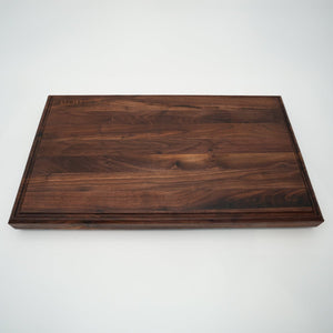 BABOSSA | Nussbaum Schneidebrett XL | Naturkante | Saftrille | 70x40x6 cm - grillstir.comBABOSSA | Nussbaum Schneidebrett XL | Naturkante | Saftrille | 70x40x6 cmHolzbrettBABOSSAgrillstir.com